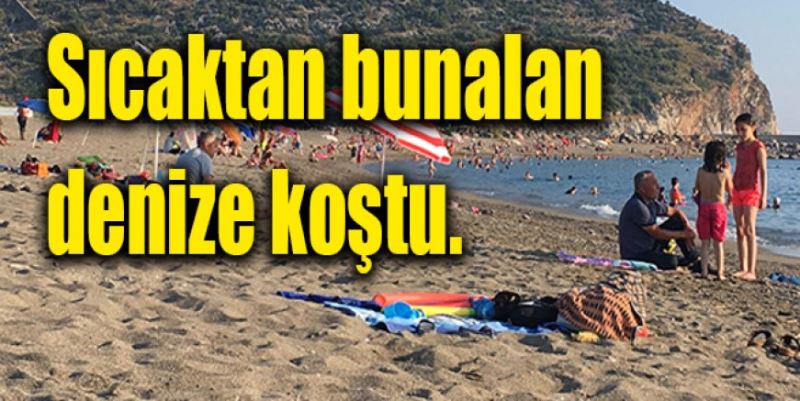 SICAKTAN BUNALAN DENİZE KOŞTU